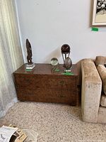 Full view of 2-drawer chest beside sofa