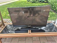 Front view of Samsung 32-inch TV on stand