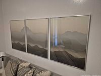 Full view of triptych hung on wall above sofa