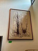 Full view of framed mixed media artwork on wall