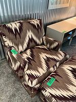 Armchair front quarter view showing upholstery pattern and condition