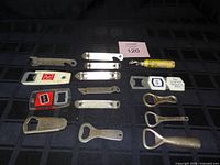 All 15 openers laid out on black grid fabric