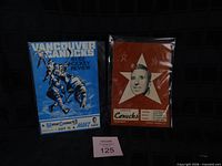 Front covers of both Vancouver Canucks WHL programs