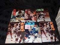 Six 1970s Vancouver Canucks magazines laid out, showing front covers