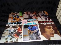 All six Vancouver Canucks program magazines laid out for full view