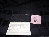 Front view of sealed coin set and specification card