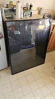Full view of black metal jersey frame standing upright
