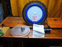 Front of AgroLED Sun Par 390 fixture with LED array visible, diffuser lens, hook, power cord