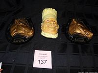 Overall view of Bossons chef plaque flanked by two horse head plaques