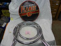 seat cushion, support rings and legs on cloth backdrop