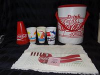 Group view: cooler, three cups, megaphone, towel