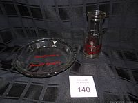 Pie plate and milk bottle together for lot overview