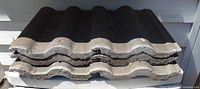 Stacked concrete Spanish S-curve roof tiles front view
