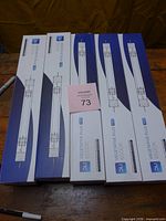 Five boxed DLI Vegetative Plus MH bulbs on table
