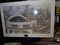 Full view of SkyDome lithograph on mat board in shrink wrap