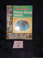 Front cover of Harris Explorer World-Wide Postage Stamp Album