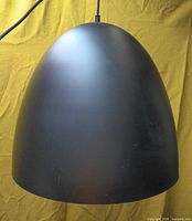 front view of black dome pendant light