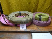 All four rolled load straps on bench