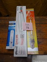 Three sealed boxes: Philips Master GreenPower 315W, Light Energy Super HPS 1000W, HiLux Gro HPS 1000W