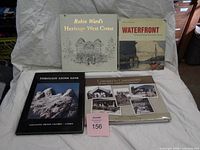 All four hardcover books front covers visible