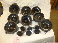 Group shot of eight 5" speakers and six 2" speakers