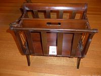 Top view of mahogany magazine rack showing divider and slatted sides