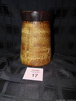 Front view of stoneware canister body
