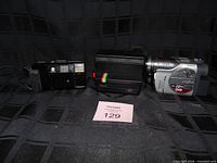Front view of Minolta Freedom II, Polaroid Spirit 600, and Hitachi DVDCam together
