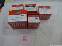 Five sealed Niehoff Ultra boxes with part numbers visible