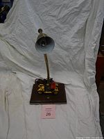 Full view of lamp showing gooseneck, shade, wood base, car model