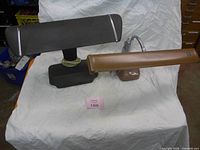 Front view of both desk lamps showing colours and overall design