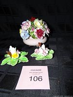 Bowl with floral arrangement and two candle holders