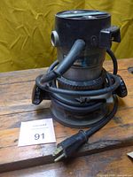 Full front view of Rockwell 6752C router with cord wrapped and plug visible