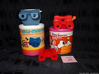 Overall lot with both viewers, both canisters, loose part