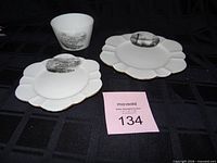 Overall view of three porcelain pieces: two plates and one cup