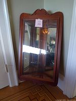 Full view of front showing glass door and cherry frame