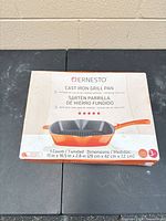 Front of sealed Ernesto cast iron grill pan box showing product image and dimensions