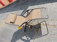 Full view of foldable zero-gravity outdoor lounge chair in reclined position