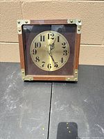 Front view of Pioneer Seed Company square wall clock