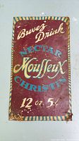 Front of metal sign showing graphics and text