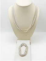 Necklace on display bust with bracelet below