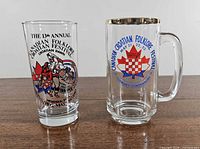 Both souvenir glasses side by side on tabletop