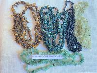 Group view of all five stone chip strands showing colors and label