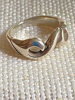 Front three-quarter view of sterling silver wave ring