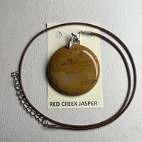 Front view on display card showing pendant colour and chain