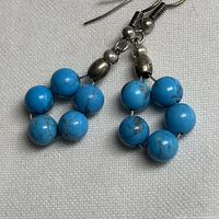 Full view of both earrings showing bead arrangement and hooks