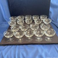 All 19 stemmed etched glass coupes grouped