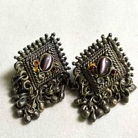 Full view of both earrings showing overall design and dangles