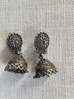 Front view of both earrings showing filigree detail