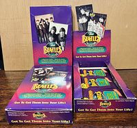 Two River Group Beatles Collection display boxes opened with visible card packs and inserts